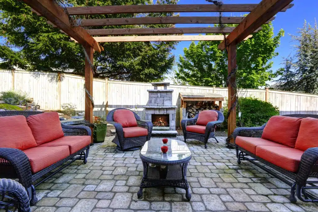 a patio with a table and chairs