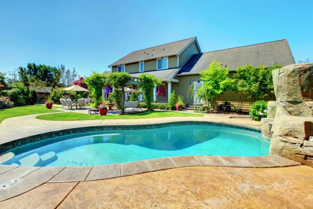 a swimming pool in a backyard of a house